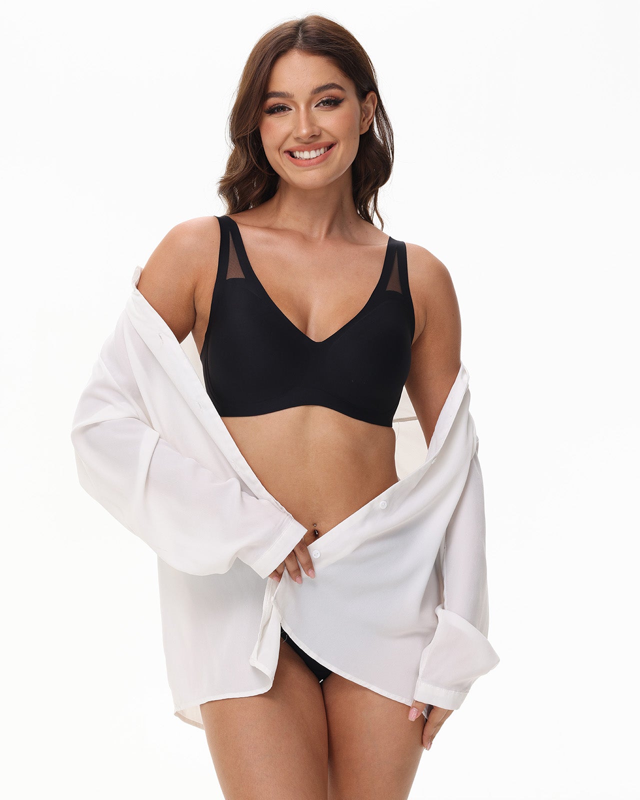Model in black Wingslove wireless bra under outfit, ideal for work, sleep, or pregnancy wear