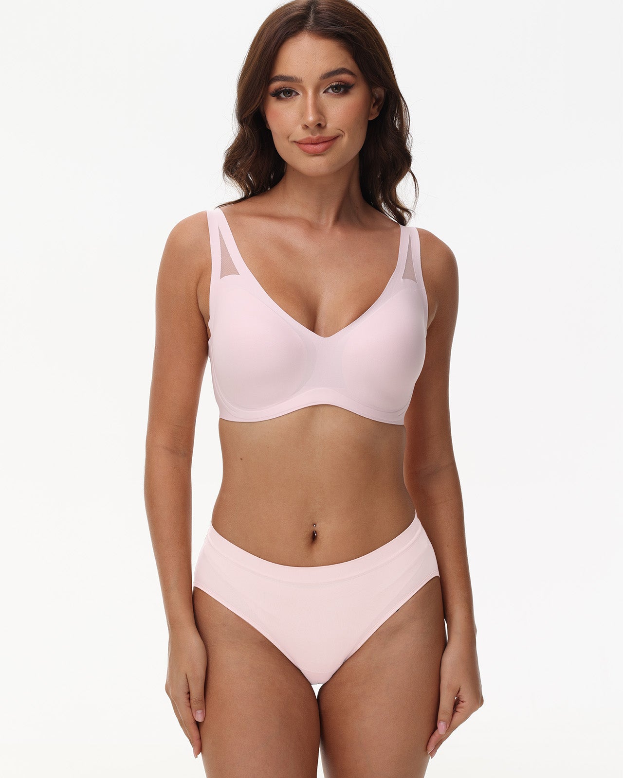 Model showcases deep V neckline of Wingslove wireless seamless bra in pink with shaping support