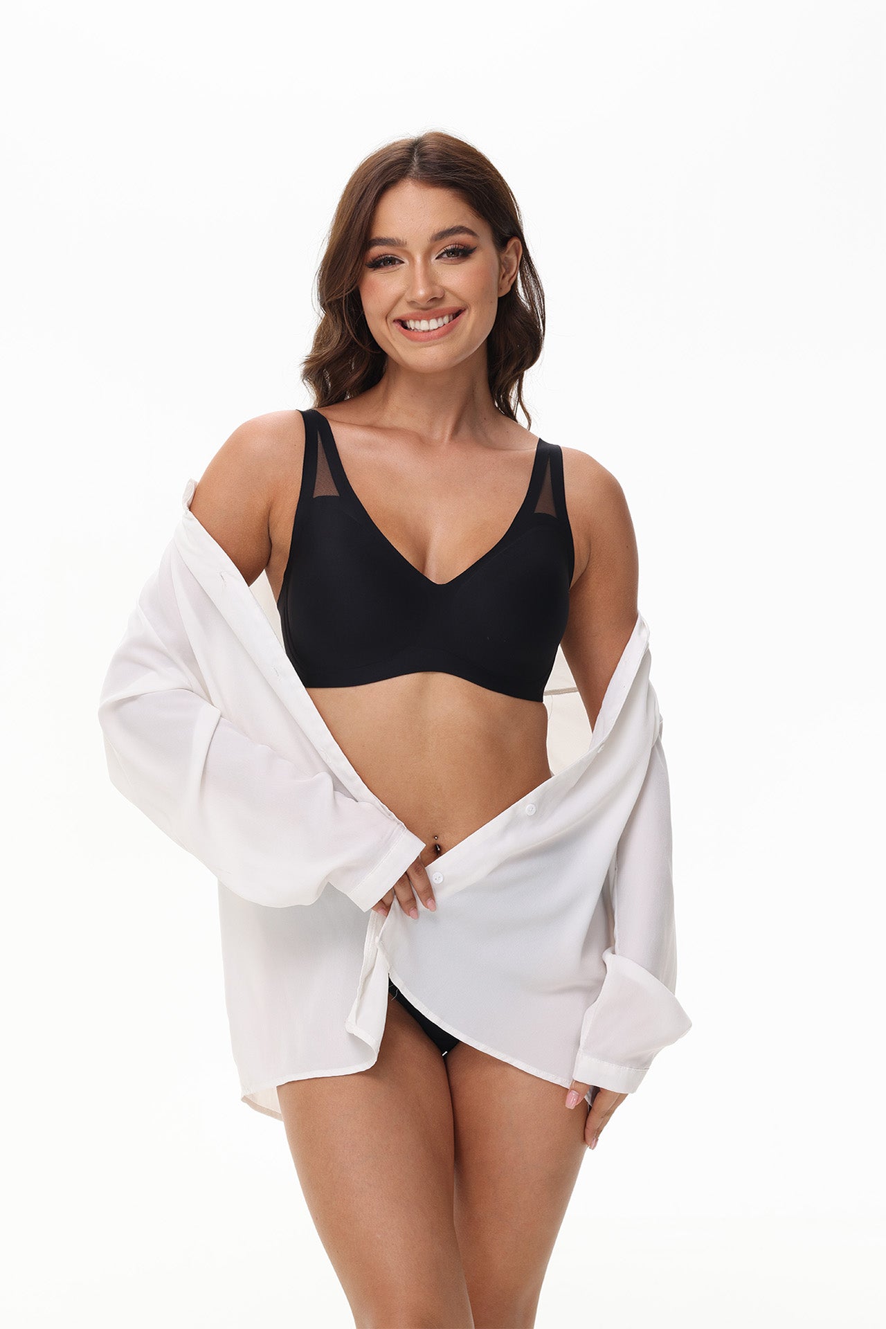Model in black Wingslove wireless bra under outfit, ideal for work, sleep, or pregnancy wear