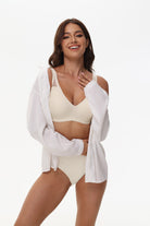 Model wearing Wingslove light nude deep V wireless bra under clothing, perfect for daily and maternity wear