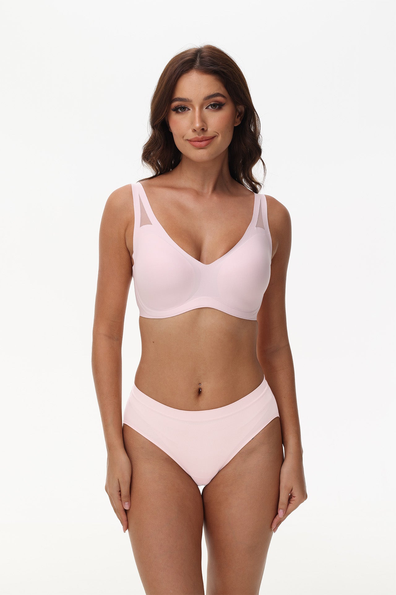 Model showcases deep V neckline of Wingslove wireless seamless bra in pink with shaping support